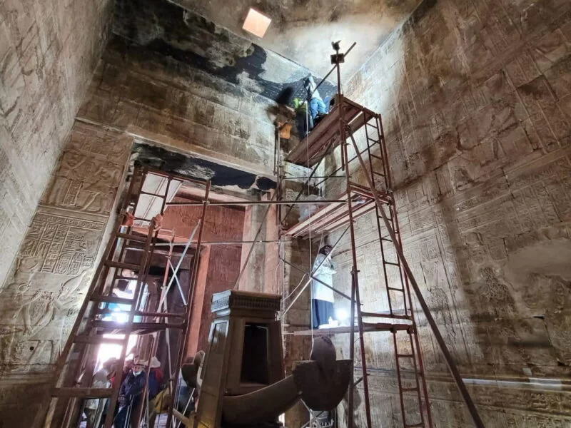 Restorers working inside the temple of Edfu.